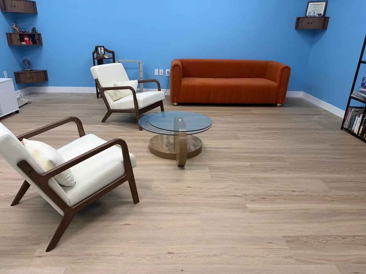 Assembled seating and glass coffee table in a Mission Hills office