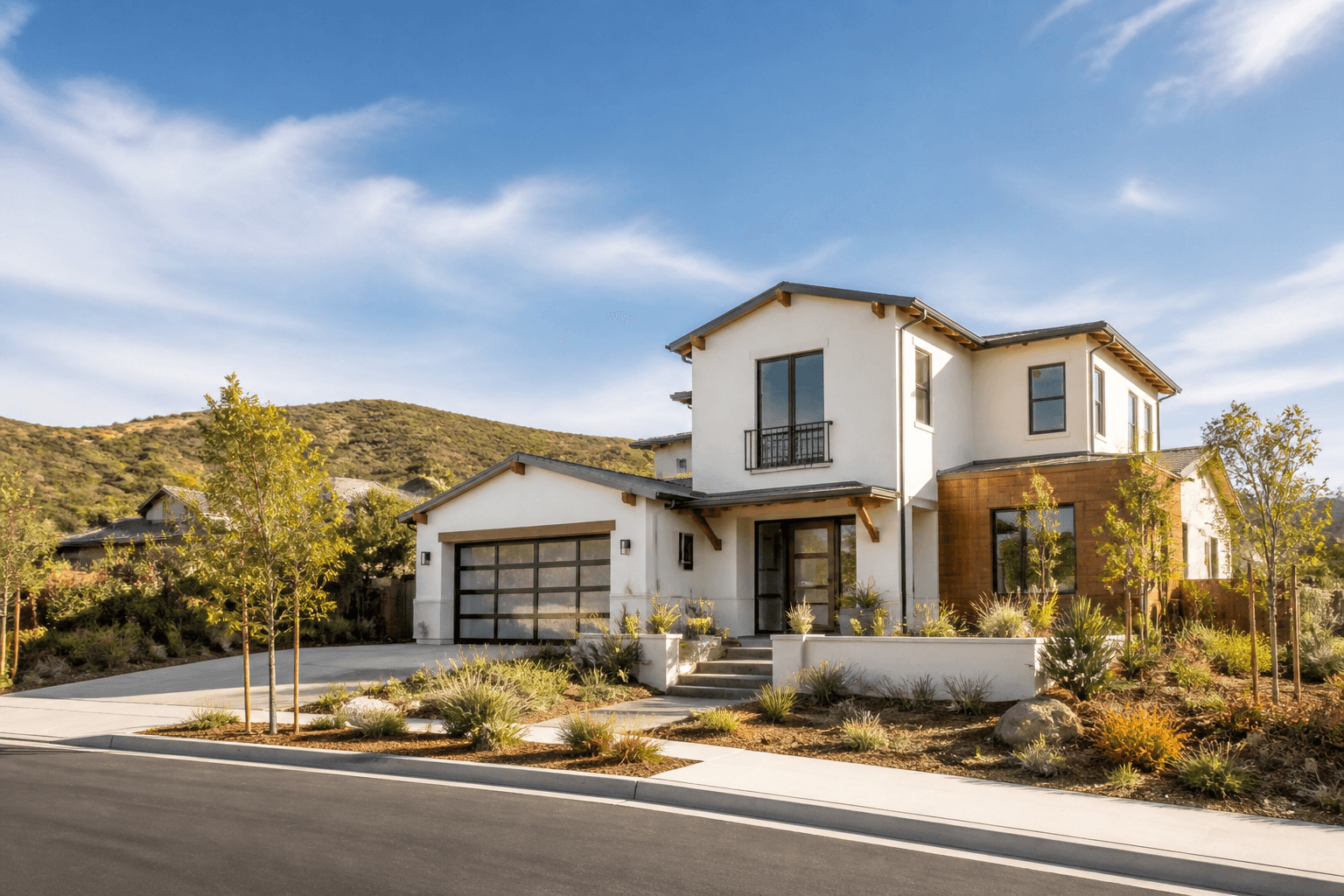 Illustrative newer California home with drought-tolerant landscaping and nearby hills, inspired by Carmel Valley.